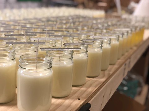 Hand-poured candles on table